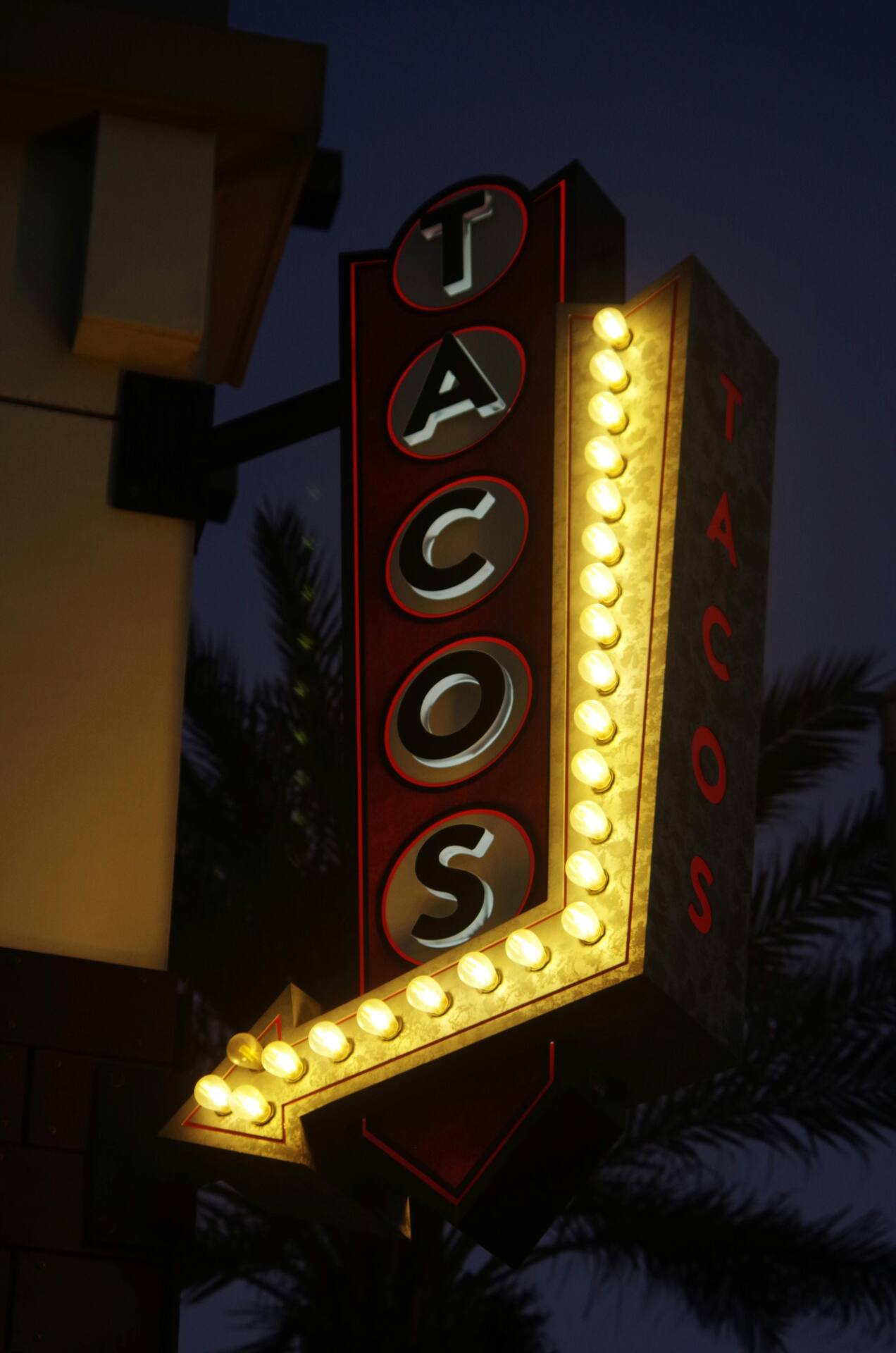 Neon taco sign evoking the roadside Americana of 1960s Los Angeles